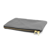 a gray zippered pouch with a gold zipper