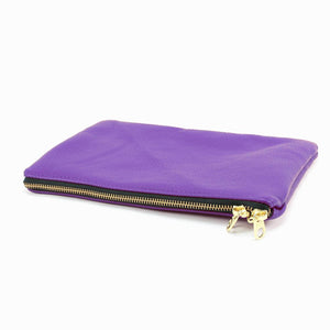 a purple purse with a gold zipper on a white background