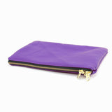 a purple purse with a gold zipper on a white background