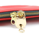 a close up of a red purse on a white background